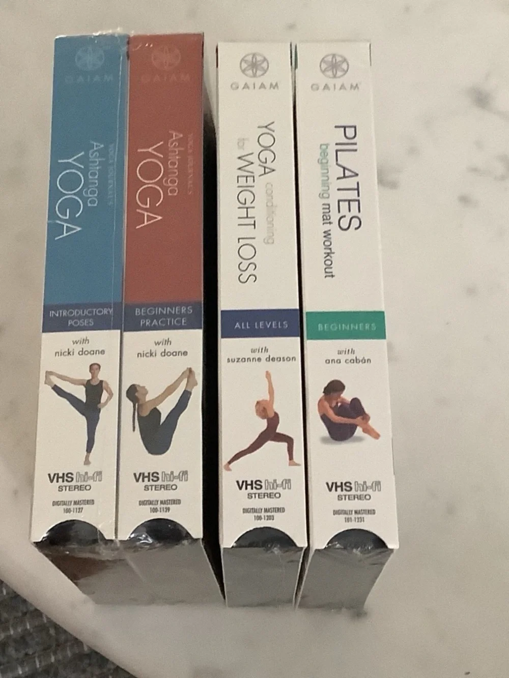 Gaiam Yoga & Pilates VHS Set - White Cover with Purple Apparel